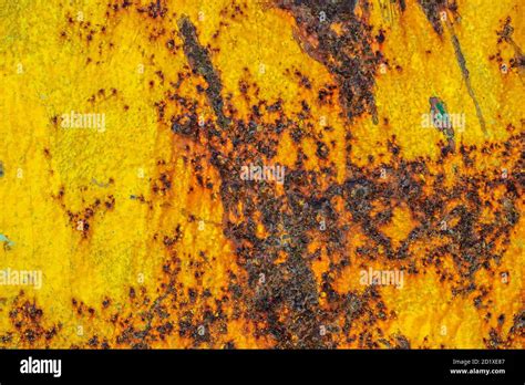 Rusty yellow metal background surface Stock Photo - Alamy