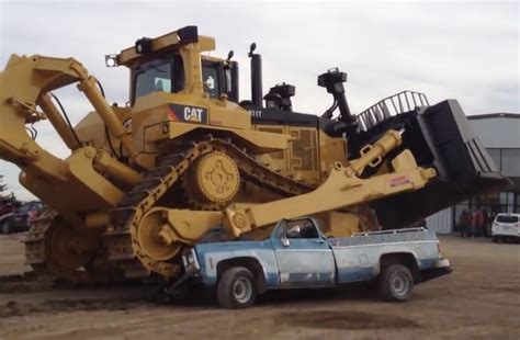 Watch this Caterpillar D11T annihilate an old pickup truck because of hockey | Equipment World