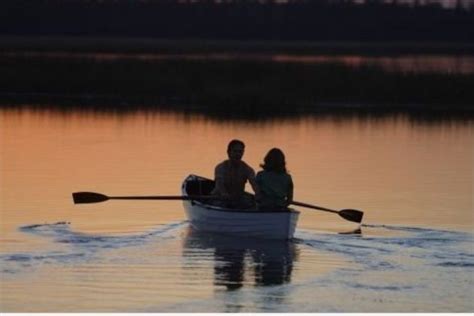 scene from "The Notebook" movie; lovers; couple; rowboat; romance; romantic; boat; lake; sunset ...