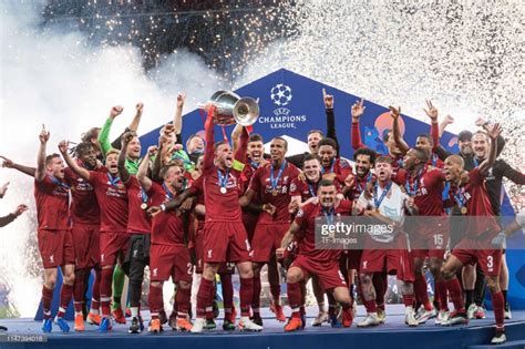 Players of FC Liverpool celebrate with the trophy after winning the UEFA Champions League ...