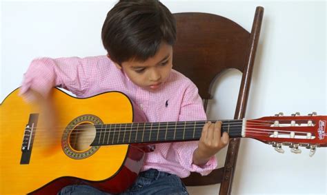 Kids Learn How to Play Guitar Lessons in 10 Steps – Children in Homes Music Lessons