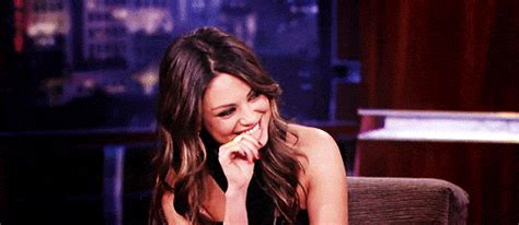 Mila Kunis Laughing and Biting Thumb | Gifrific