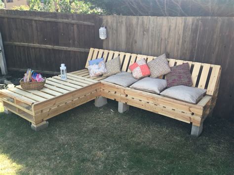 Our outdoor pallet sofa made by my amazing man! Now just needs a paint ...