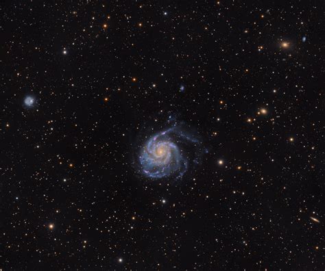 My image of the Pinwheel Galaxy with numerous other galaxies in the background to make you feel ...