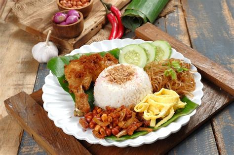 Premium Photo | Nasi uduk Betawi,Coconut flavored steamed rice dish from Betawi, Jakarta.served ...