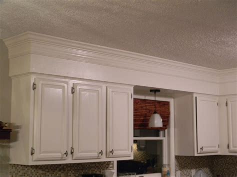 Crown Molding Above Cabinets - Build a frame if necessary.