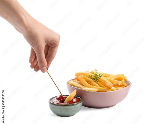 Woman dipping french fries into ketchup on white background, closeup Stock Photo | Adobe Stock