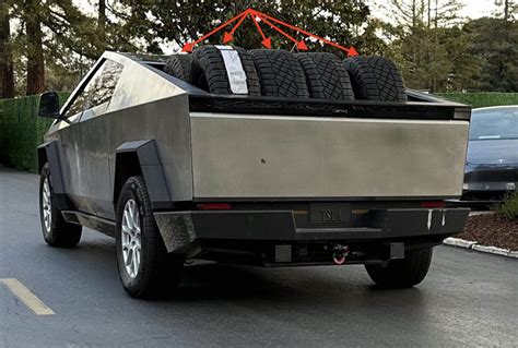 Tesla Cybertruck alpha prototype shows off its bed's capacity by carrying multiple off-road tires