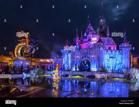 Banksy's Dismaland illuminated at night Stock Photo - Alamy