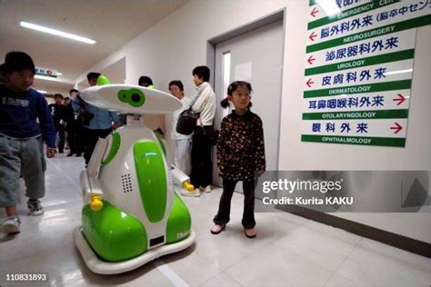 Japan Introduces First Hospital Robot Guide Photos and Premium High Res Pictures - Getty Images