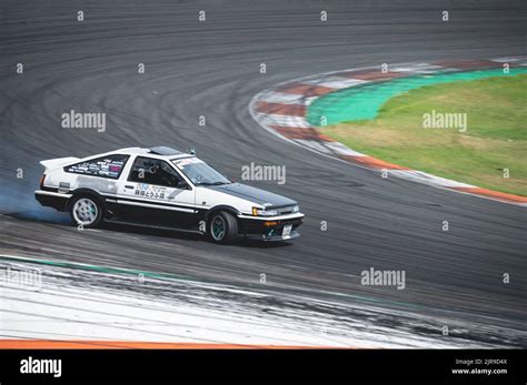 A Toyota Corolla Sprinter Trueno AE86 practicing drifting techniques on ...