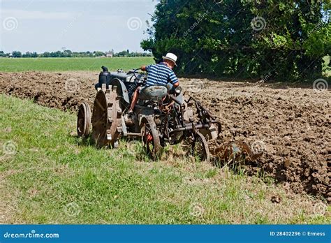 Plowing With An Old Tractor Editorial Photo - Image: 28402296