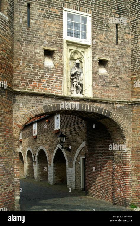 South gate in medieval tower entrance to historic Delft city center in Netherlands Stock Photo ...