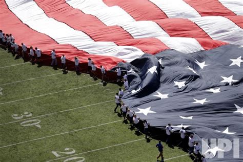 Photo: A giant American Flag is rolled out on the field at MetLife ...