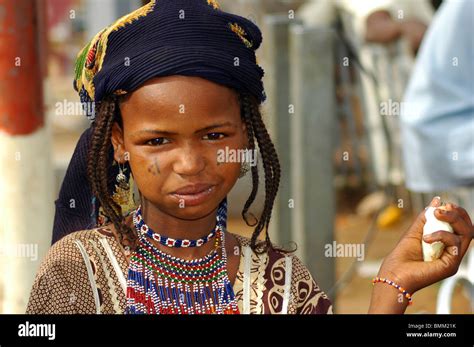 Niger, Niamey, African girl in traditionnal clothes and a black coif ...