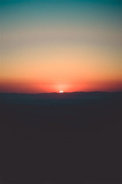 Silhouette of Mountain during Sunset · Free Stock Photo