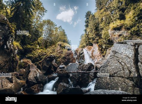 Tranquil waterfalls along Retezat mountain river.Carpathian mountains in summer and beautiful ...