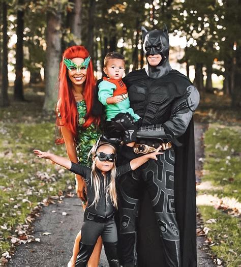 three people dressed up as batman and robin wayne pose for a photo with ...