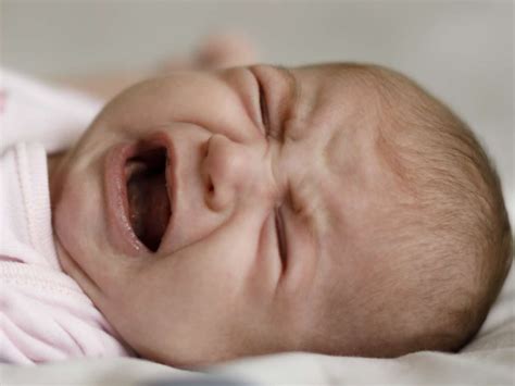 Baby crying in sleep: What's normal and how to soothe them