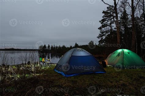 Camping and tenting by the Lake 15185164 Stock Photo at Vecteezy