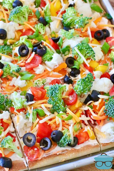 With only a few ingredients, this Easy Veggie Pizza recipe is made with pizza dough, veggie ...