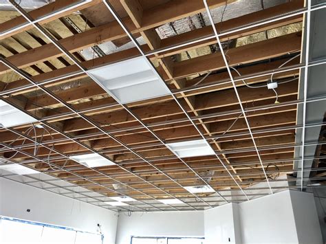 Drop ceiling grid is ready for lighting and diffusers at BP in Waukegan | America's Custom Home ...