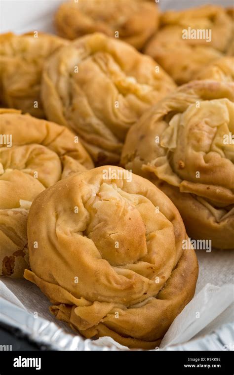 Baked homemade traditional Greek cheese pies Stock Photo - Alamy