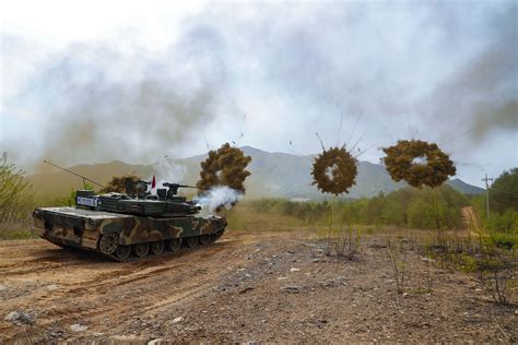 South Korean K1 tank assigned to the 21st Infantry Division deploys smoke grenades during an ...