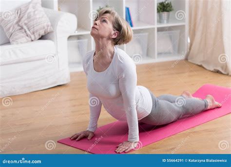 Older woman and yoga stock image. Image of person, active - 55664291