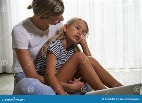 Mother Hugging Sed Daughter Stock Photo - Image of hugging, helping: 145763734