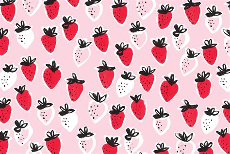 a pink background with black and white strawberries