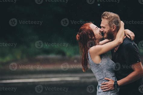 beautiful couple hugging in the rain 11740771 Stock Photo at Vecteezy