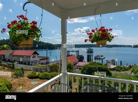 View of the Orcas Island Ferry Landing with an approaching ferry from the Orcas Hotel, a ...