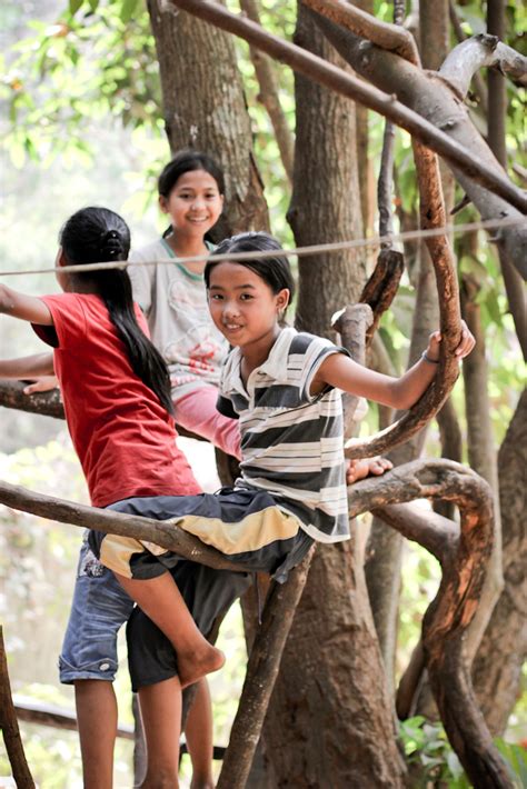 Cambodia children in tree - Inspire A Fire