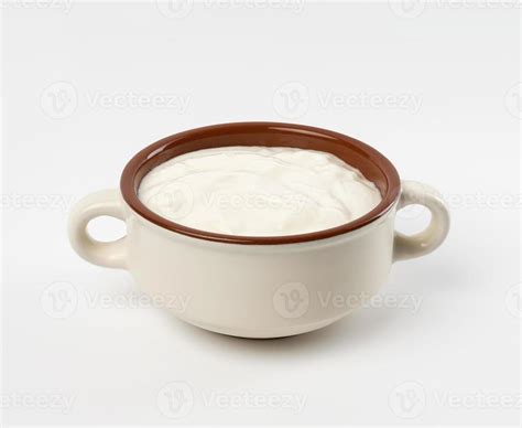 sour cream in a brown ceramic bowl on a white background, fermented milk product 18954494 Stock ...