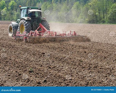 Man Work With Tractor And Harrow Stock Image - Image: 23778401