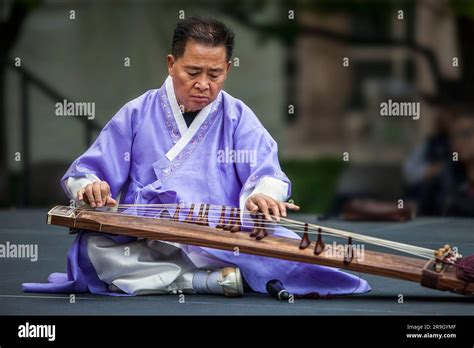 Musician plays gayageum, traditional instrument, at Korean Festival, Getty Center, Los Angeles ...