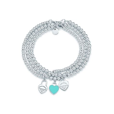 Return to Tiffany™ mini heart tags on sterling silver bead bracelets. | Tiffany & Co.