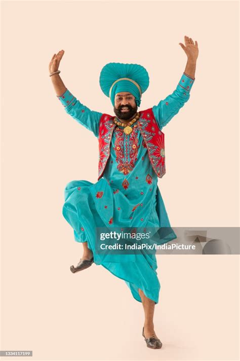 A Bhangra Dancer Demonstrating A Dance Step With Hands In The Air High-Res Stock Photo - Getty ...