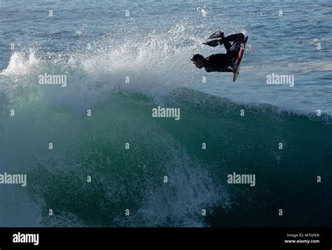 Surfing big waves at The Wedge Stock Photo - Alamy