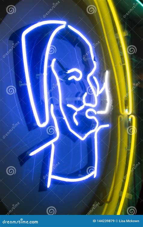 Zig Zag Man Logo On A Neon Sign Editorial Photo | CartoonDealer.com #144239879