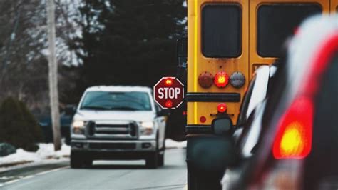 FLASHING RED LIGHTS ON SCHOOL BUSES MEANS OTHER VEHICLES MUST STOP