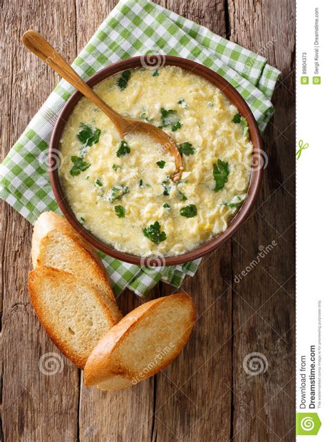 Italian Egg Soup Stracciatella with Farfalline Pasta and Parmesan Close-up. Vertical Top View ...