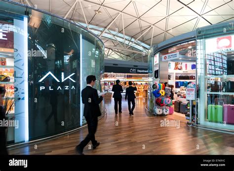 Travelers pass through the duty free shops in Incheon Airport in Incheon, South Korea Stock ...