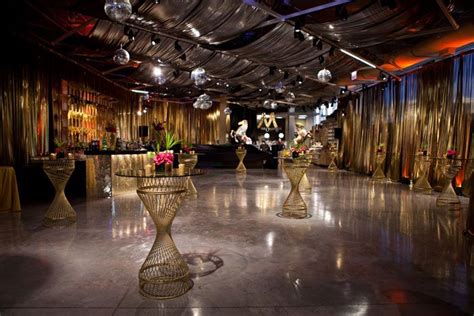 To bring a Studio-54 vibe into the Greektown store, Kehoe Designs brought in gold drapes ...