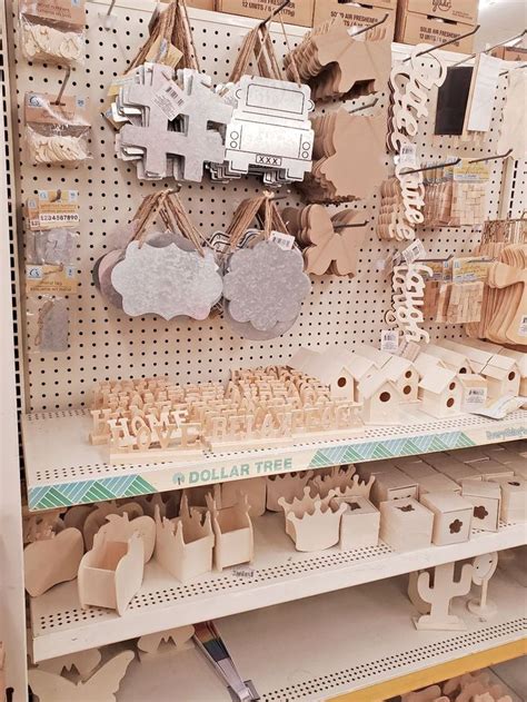 there are many wooden buildings on the shelves in this store that is filled with cardboard