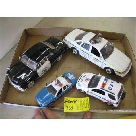 4 DIECAST POLICE CARS - Dodds Auction