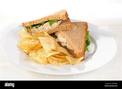 A tuna sandwich with potato chips Stock Photo - Alamy