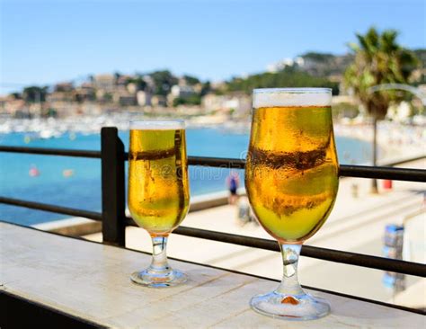 His and Hers Ice Cold Beers on a Hot Summer Day with a View Stock Photo ...