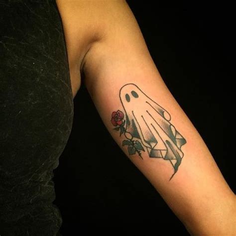 Picture Of Ghost and red rose tattoo on the arm